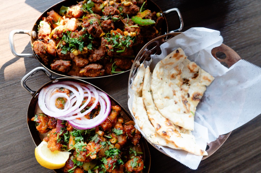 Naan and curries on a buffet